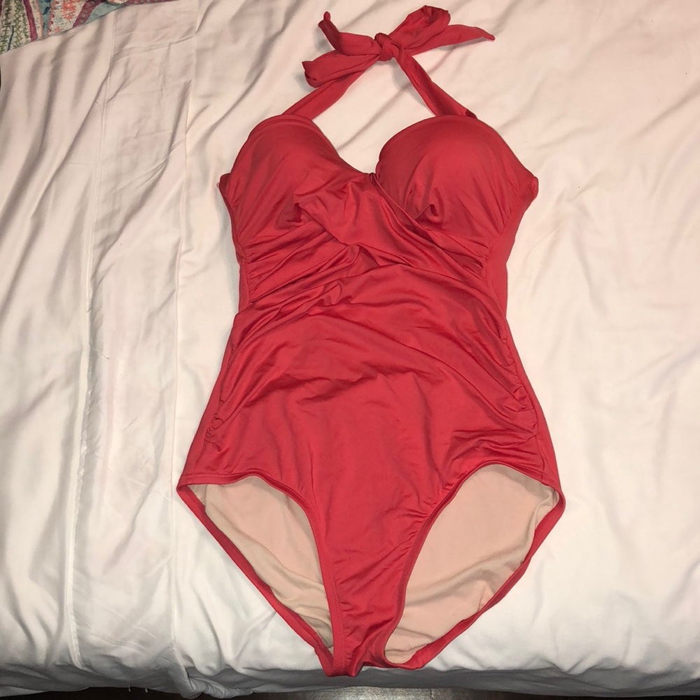 I am selling one piece pink bathing suit.